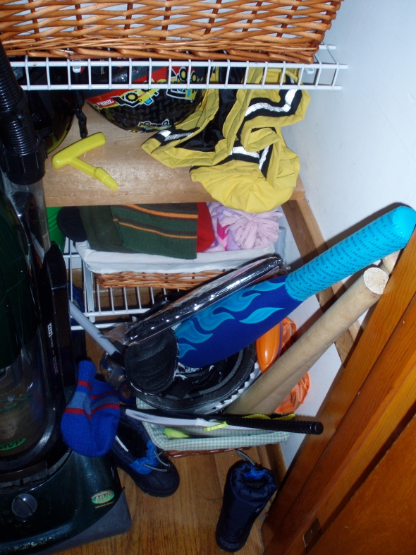 The bottom of the closet housed 'outdoor toys' in a basket.  Needles to say, the items were never properly put back.